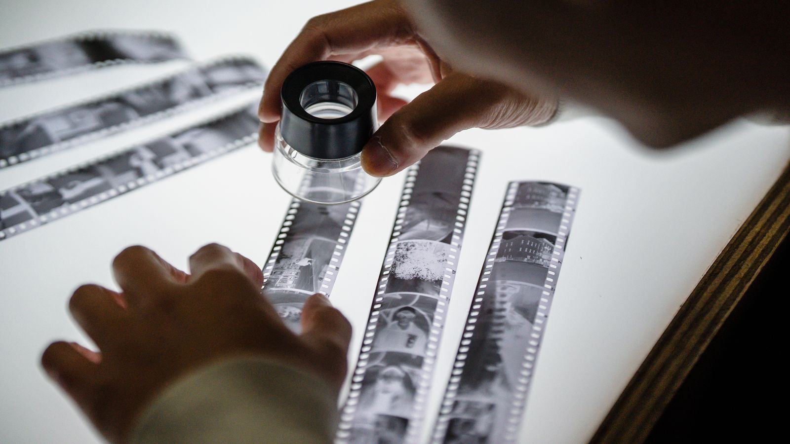 Contact sheet of reference photographs and film stills spread out in a grid