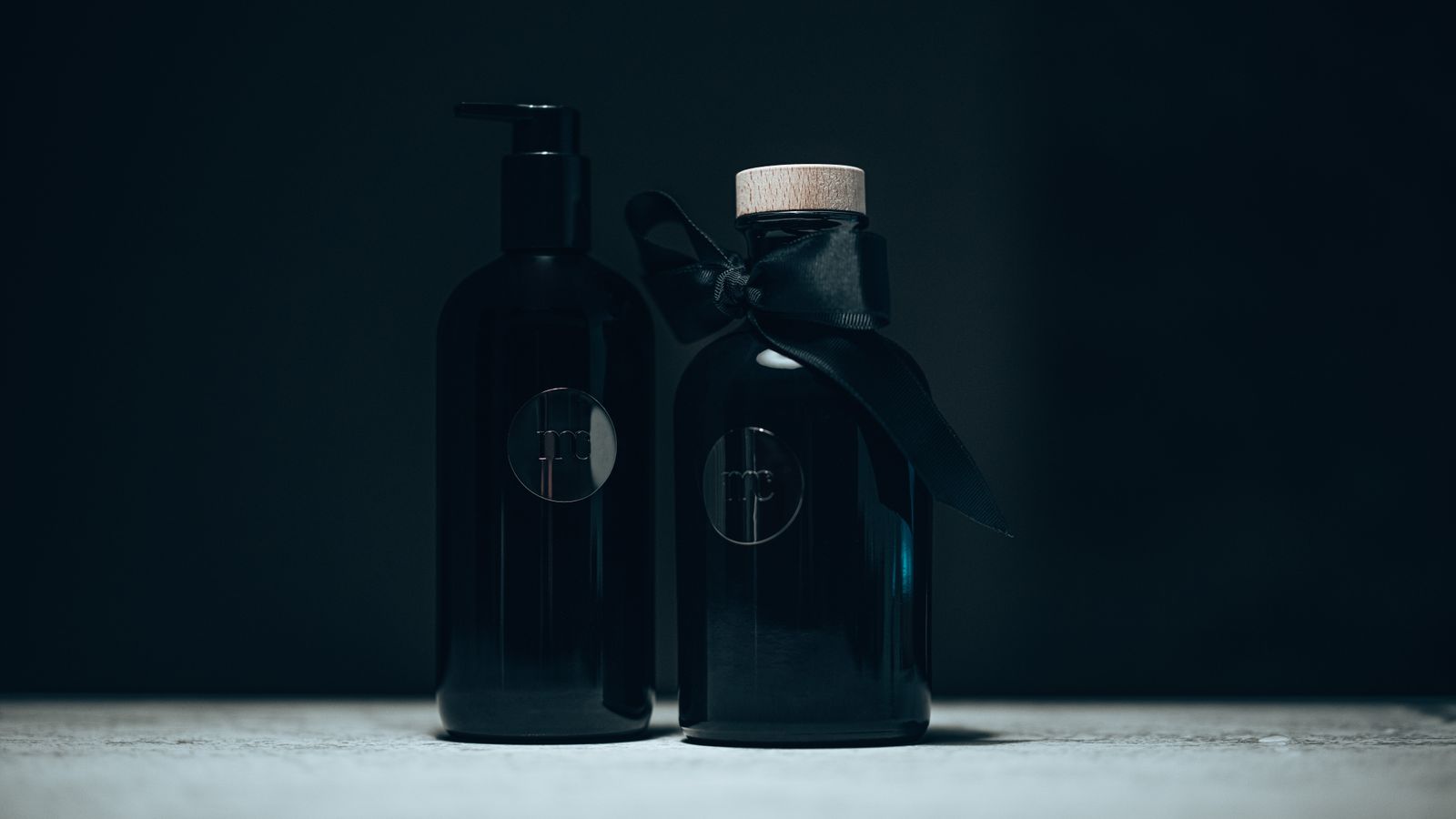 Studio still life of a glass fragrance bottle under directional light
